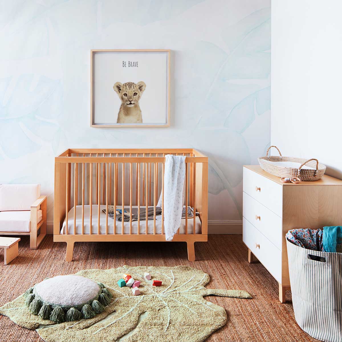 Woodland nursery decor featuring framed baby woodland creatures art prints in a beautifully designed room