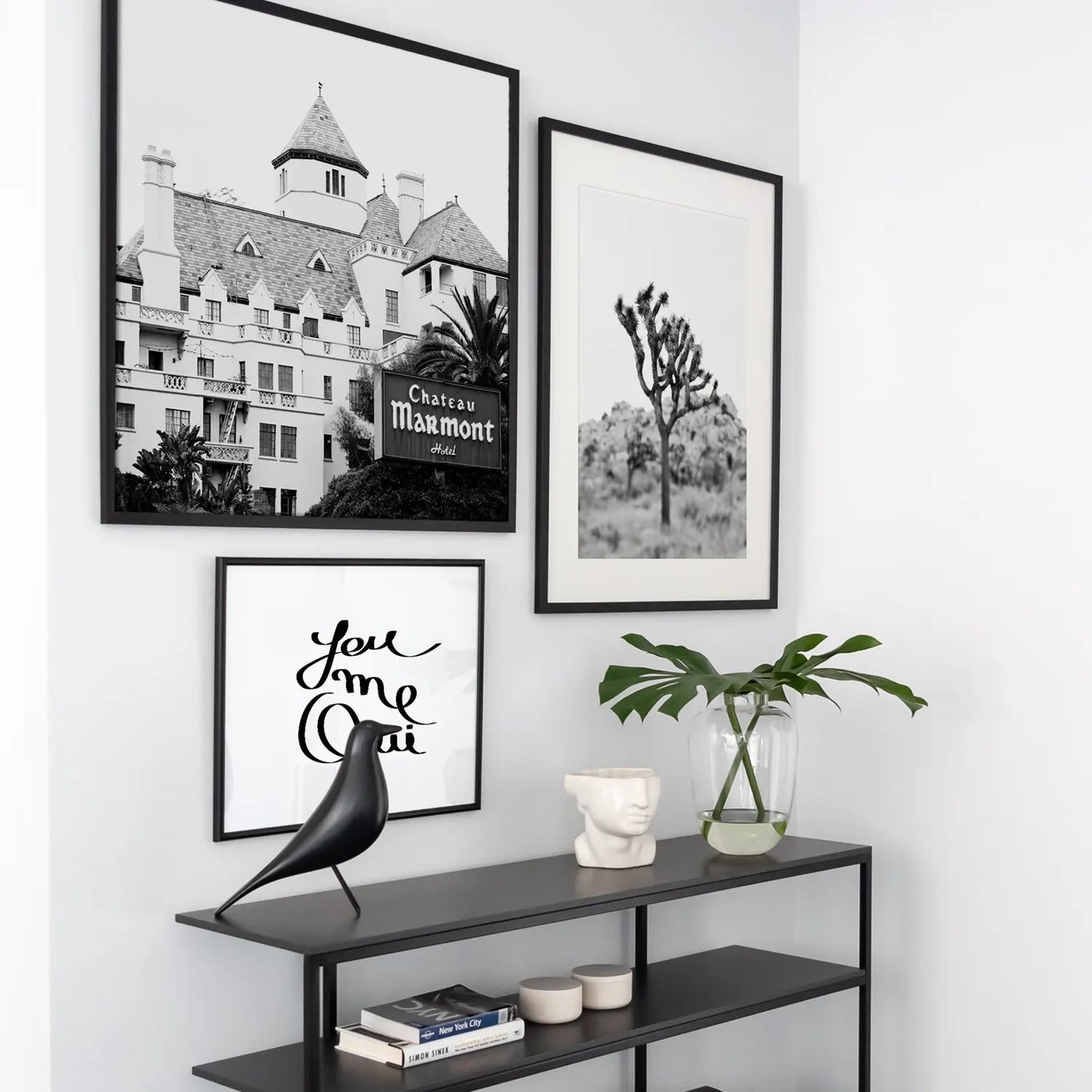 Typography Prints home wall decor framed above a couch in a living room 