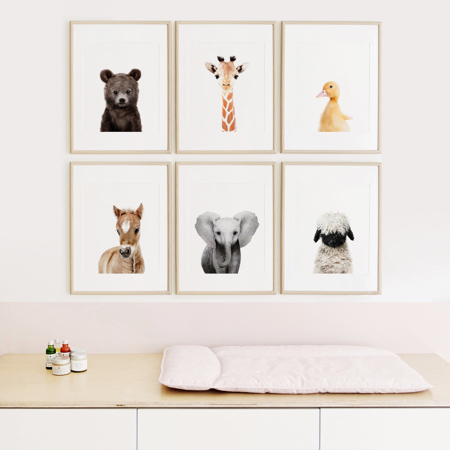 animal prints for nursery framed above the changing table 