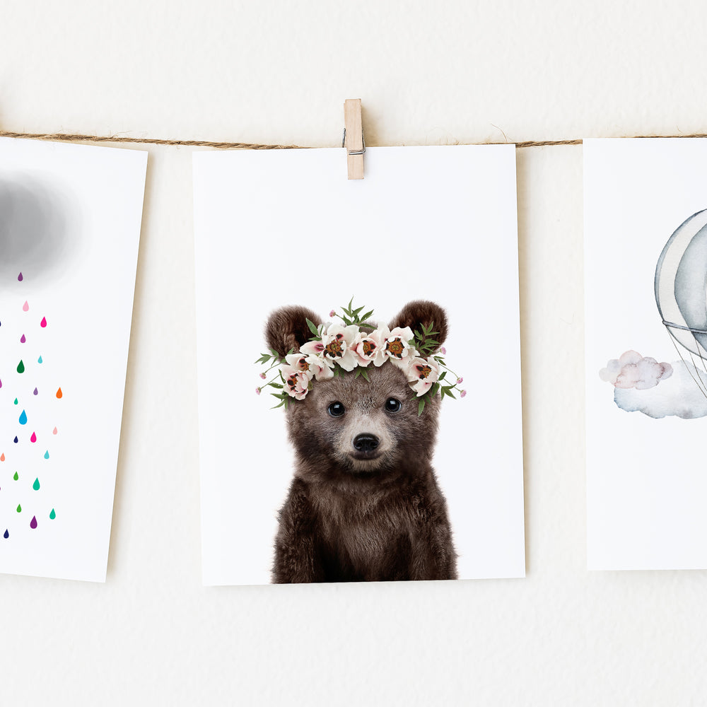 
                      
                        A picture of a baby bear wearing a flower crown.
                      
                    