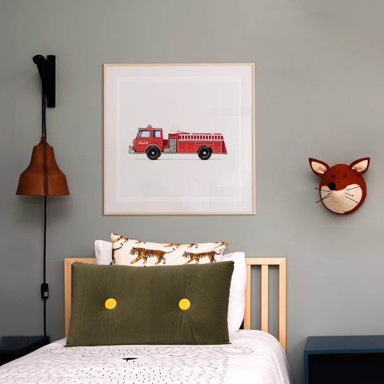 Red fire truck print in a boys room