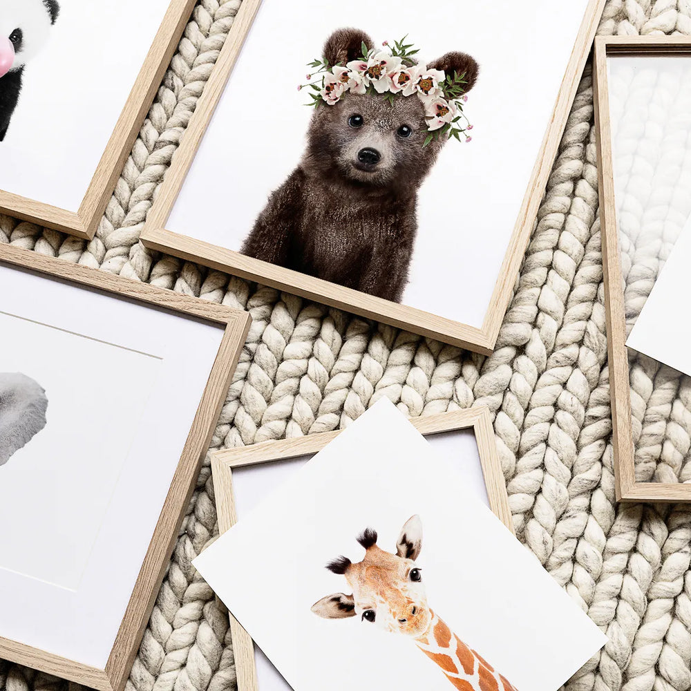 Charming animal-themed nursery with adorable baby animal prints on the walls