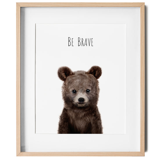 Nursery wall art of a baby bear with the words "Be Brave" in a nursery